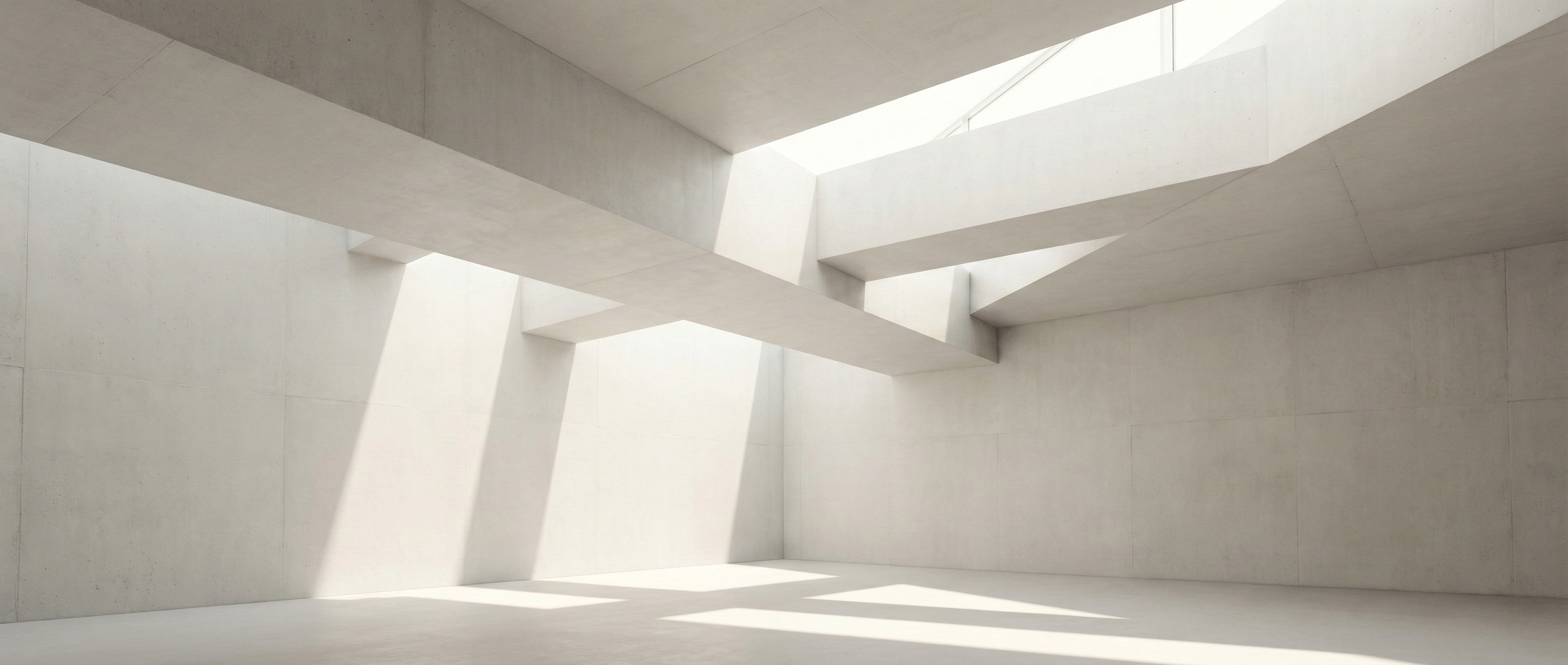 Architectural interior with intersecting concrete planes and natural light